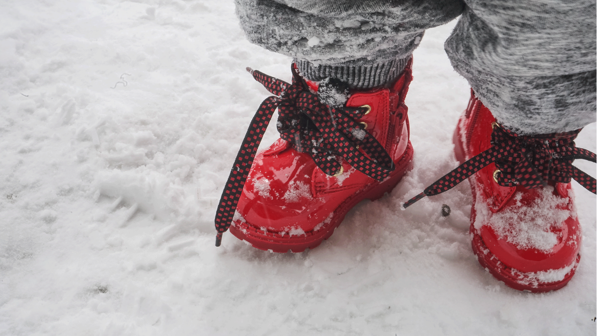 photo of child wearing red boots